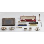 A collection of hallmarked silver ware, to include a pierced dish, a paten, an inkwell, two napkin