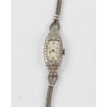 A ladies Art Deco style Rolex diamond cocktail watch, the cream dial having alternate Arabic
