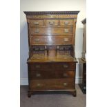 A 19th century oak secretaire chest on chest fitted with three drawers to base, two long, three