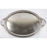 A Goldsmiths & Silversmiths Co. silver two handled decorative tray, engraved with repeat design