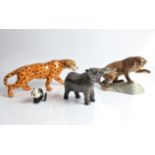 A Beswick Leopard, Elephant, Panda and Puma On Rock. IMPORTANT: Online viewing and bidding only.