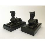 A pair of bronze sphynx figures on black marble bases, heights 13cm. IMPORTANT: Online viewing and