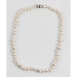 A single row of approx. 52 cultured pearls, diameters approx. 6/7mm, with five diamond accent set