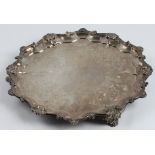 A Victorian silver salver, with scroll and scalloped patterned rim, engraved to centre with