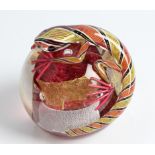 A Michael James Hunter Twists Scottish glass paperweight topped with yellow and red lizard, labelled