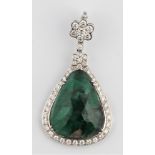 A green hardstone and diamond pendant, set centrally with a triangular faceted green hardstone,