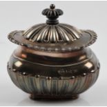 A Mappin & Webb hallmarked silver sugar bowl, having gadrooned lid and body, height approx. 10cm.