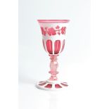 A bohemian cameo cranberry glass chalice with twisted stem and grape vine detail to top, repair
