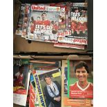 Seventeen boxes of Manchester United football programmes including an interesting selection of