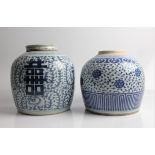 Two Chinese blue and white ginger jars, decorated with floral patterns, one missing lid, approx.