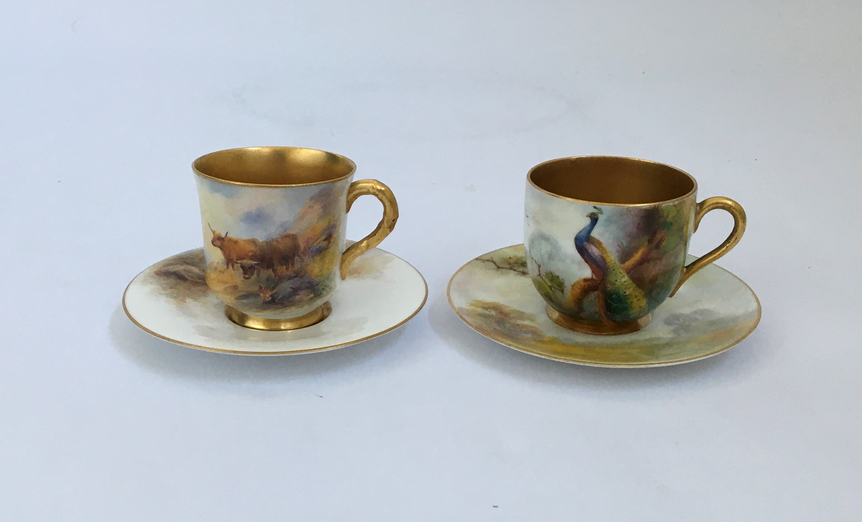 A Royal Worcester highland cattle Harry Stinton teacup and saucer, signed, with Peacock teacup and