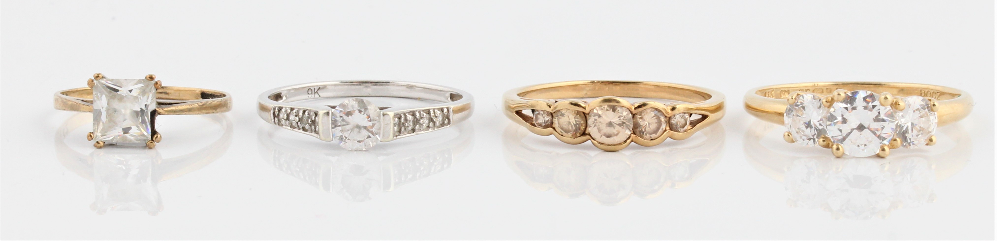 Four colourless stone rings, three hallmarked 9ct gold, the other unmarked yellow metal, ring