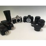 Two Nikon cameras F80 and F65, together with six various lenses including 35-70mm 1:3.3-4.5 and