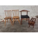 Two ercol stick back chairs with a teak mid century hoop back dining chair and a teak magazine rack.