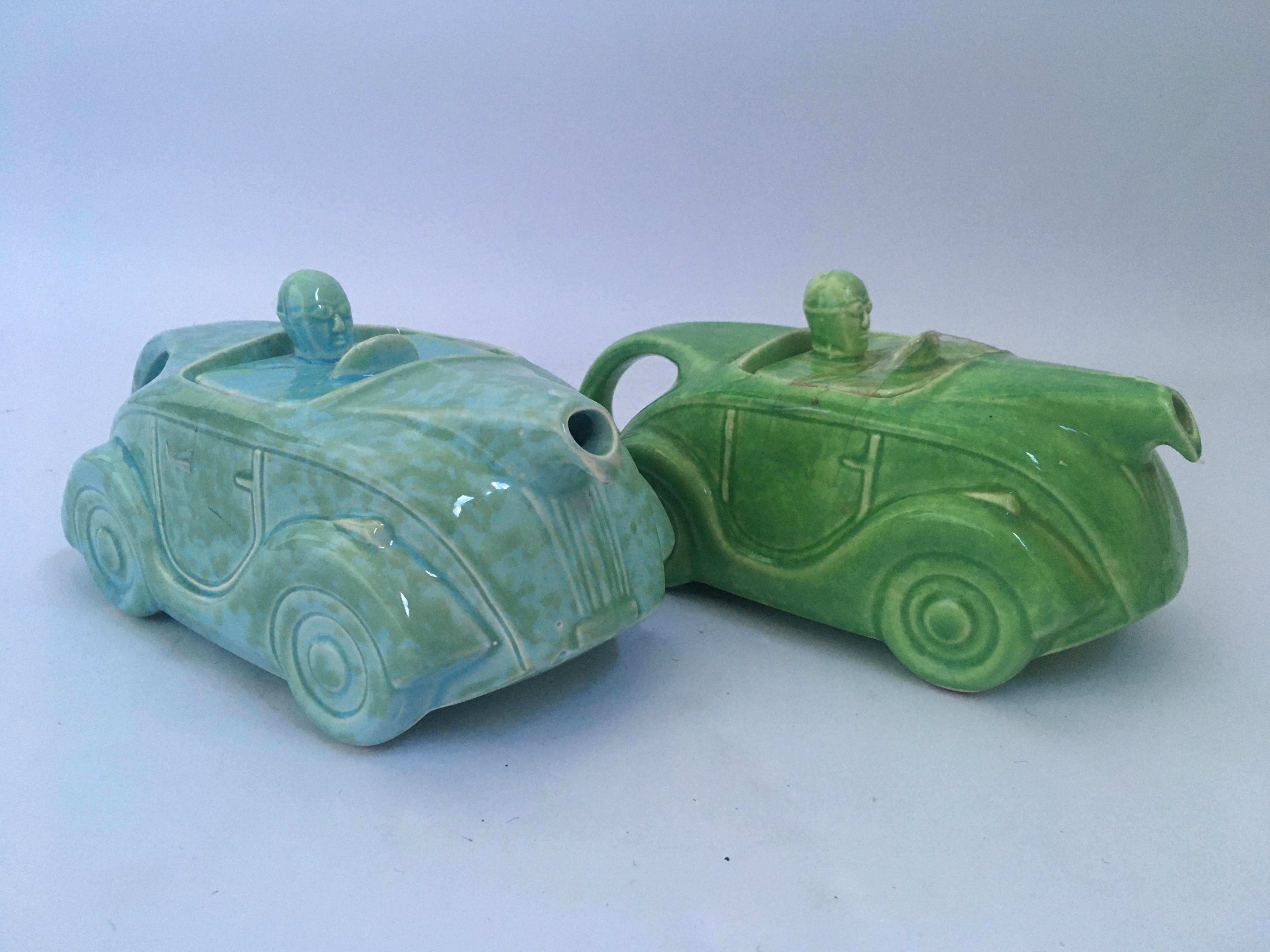 Two Sadler mottled green and blue racing car teapots. IMPORTANT: Online viewing and bidding only.