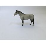 A Beswick dappled grey palomino horse. IMPORTANT: Online viewing and bidding only. Collection by