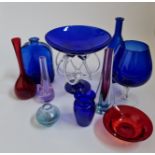 Ten various pieces of glass in blue, red and purple, to include vases, bottles, dishes and