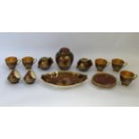 A Crown Devon part tea service with gold and burgundy oriental style design, including cups,