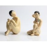 Two Chinese nude seated resin figures, one with tattoos, approx. heights 15cm. IMPORTANT: Online