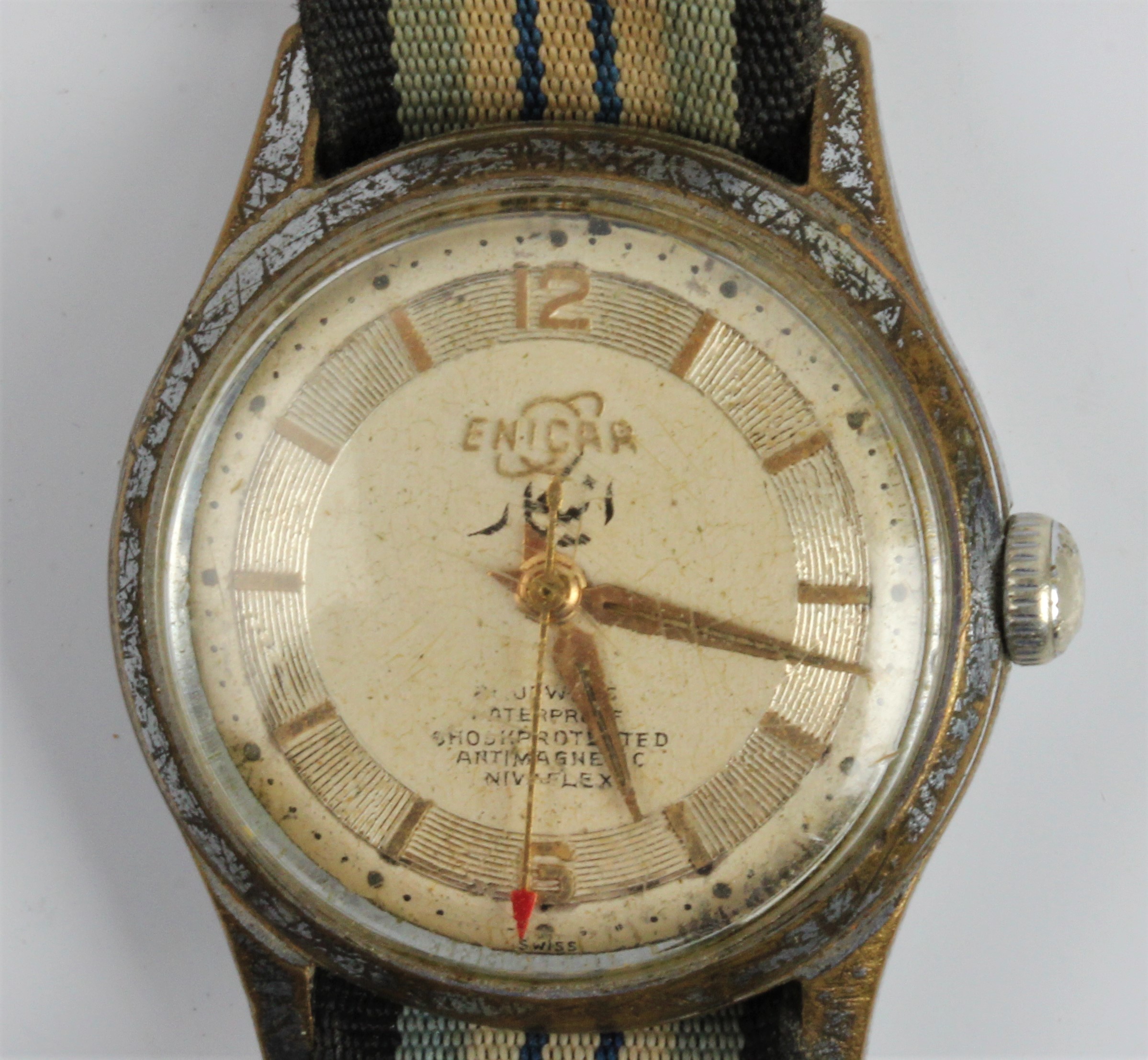 A gents ENICAR wrist watch, the gold-tone dial having hourly baton markers with 12 and 6 o'clock