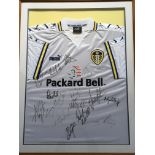 *A Leeds United FC Puma signed by team football shirt, in frame. IMPORTANT: Online viewing and