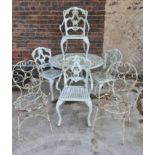 A white painted metal garden table and four chairs together with four metal garden chairs.