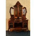 A late Victorian mahogany raised mirror back sideboard with two glazed doors to top with