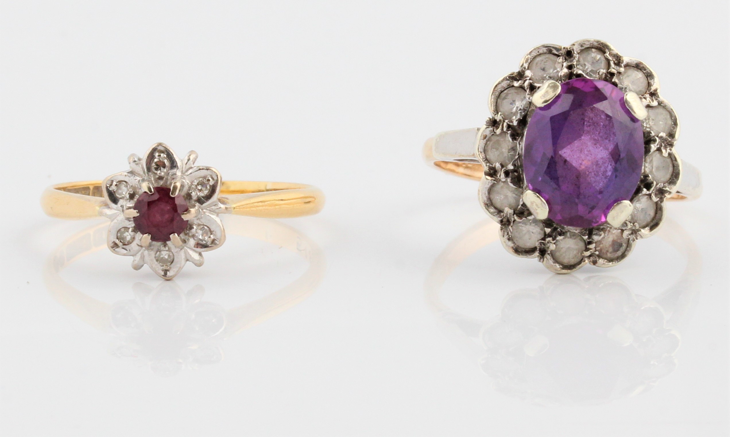 A ruby and diamond flower cluster ring, stamped 18ct, ring size P, together with a purple