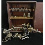 A Lorch Schmidt watchmakers lathe in mahogany box with tool head accessories.