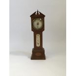 A mahogany cased Rowley&Son barometer in the form of a miniature grandfather clock, 42cm