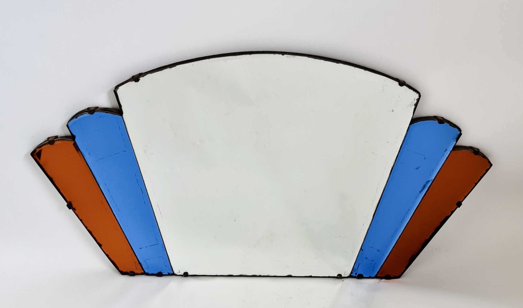An Art Deco style multi glass panel wall mirror with blue and amber glass to sides, 40cm x 70cm.