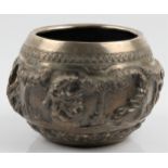 A Burmese white metal bowl, featuring repousse deity figures and repeat pattern borders, unmarked,