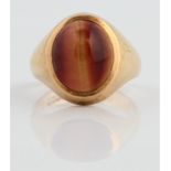 A hallmarked 9ct yellow gold banded agate cabochon ring, ring size L, approx. weight 5.8g.