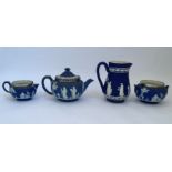 A selection of Wedgwood jasperware, two jugs, bowl and teapot. IMPORTANT: Online viewing and bidding