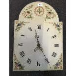 A hand painted grandfather clock face decorated with birds to corner and Roman numerals, with weight