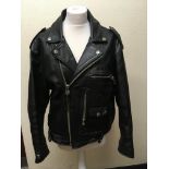 An Avirex large black leather motorcycle jacket. IMPORTANT: Online viewing and bidding only. No in