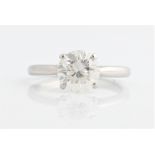 A hallmarked platinum diamond solitaire ring, set with a round brilliant cut diamond, measuring