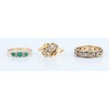 A hallmarked 9ct yellow gold emerald and diamond ring, ring size N, together with a three stone