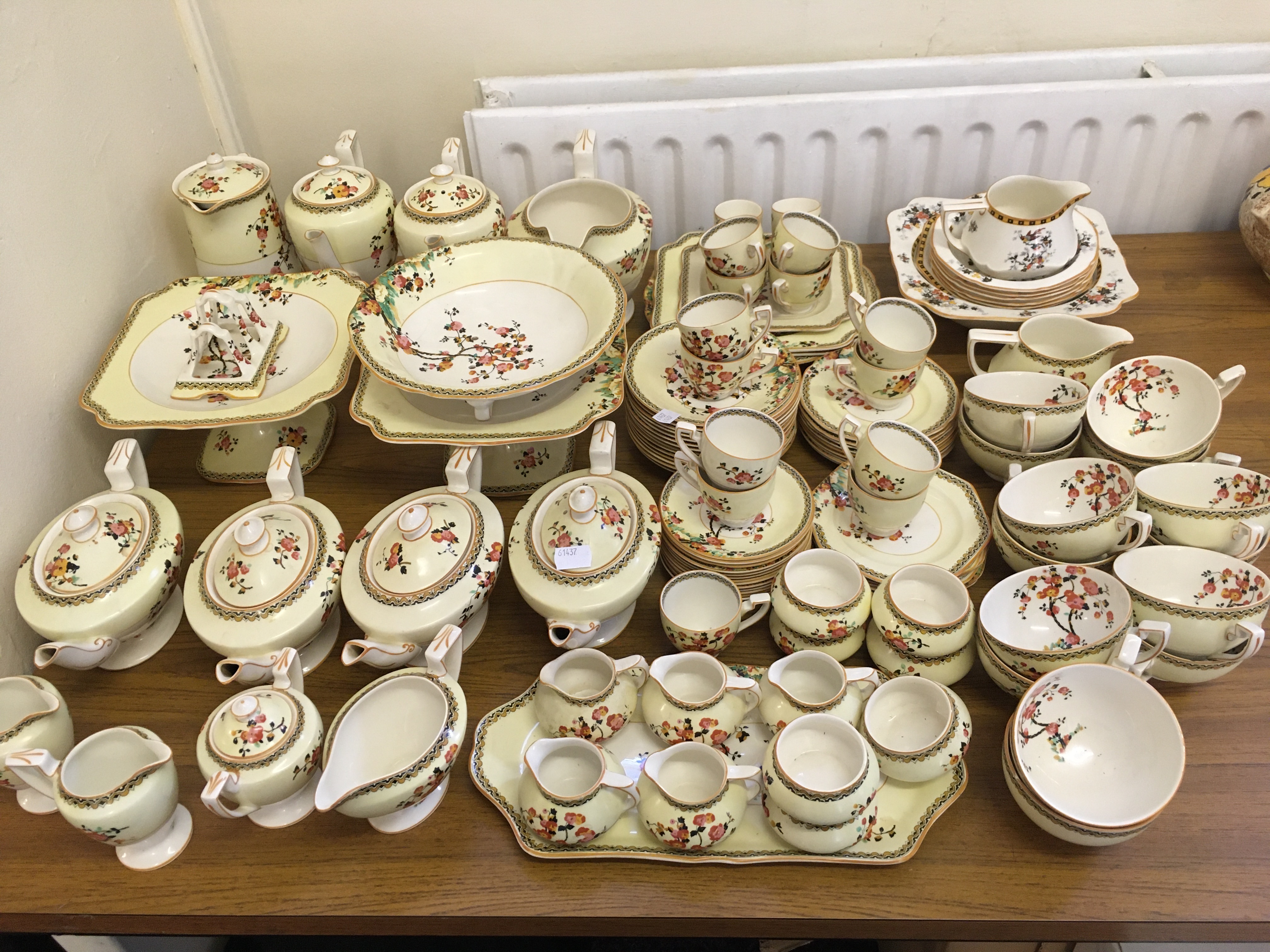 An approx. 100 piece Crown Ducal tea and coffee service in blossom tree on yellow background design,