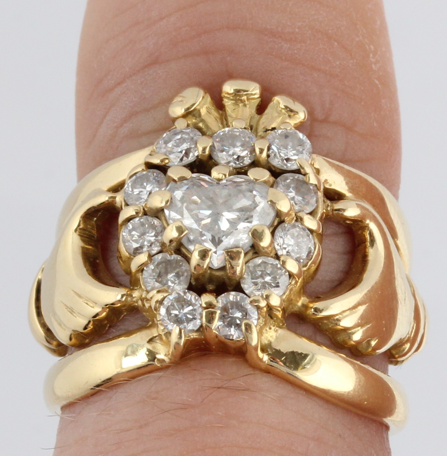 A hallmarked 18ct yellow gold diamond set Claddagh ring, set with a central heart cut diamond, - Image 2 of 2