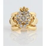 A hallmarked 18ct yellow gold diamond set Claddagh ring, set with a central heart cut diamond,