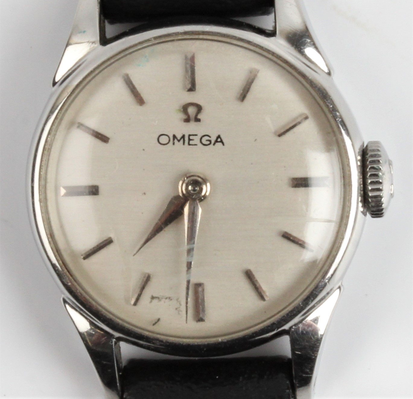 A lady's Omega wristwatch, the silver-tone dial having hourly baton markers, on black leather strap.