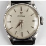 A lady's Omega wristwatch, the silver-tone dial having hourly baton markers, on black leather strap.
