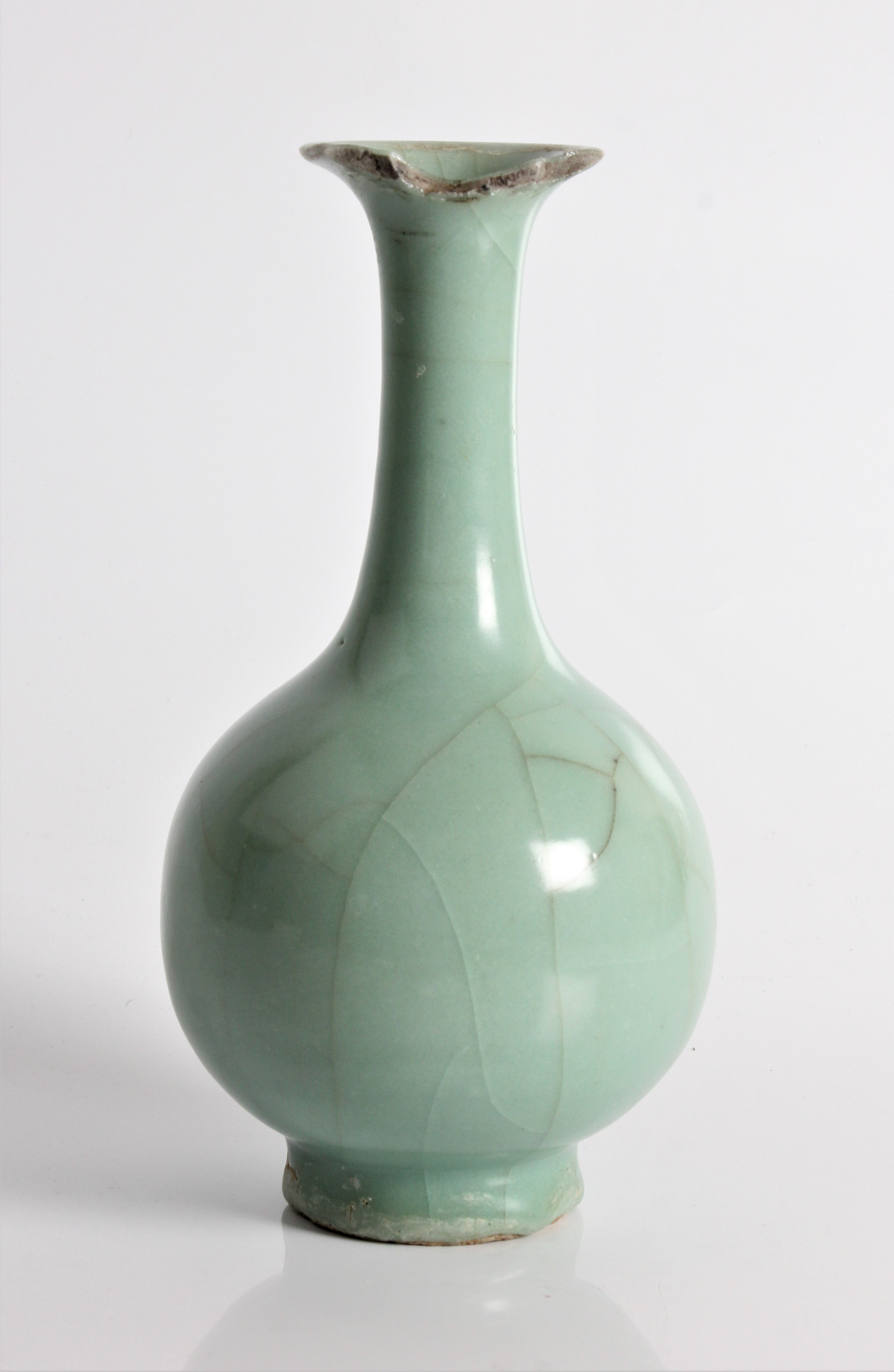 A 19th century Chinese green vase, cracked to top rim, approx. height 23.5cm. IMPORTANT: Online