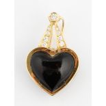 A black heart and diamond pendant, set with a black heart surmounted by graduated round brilliant