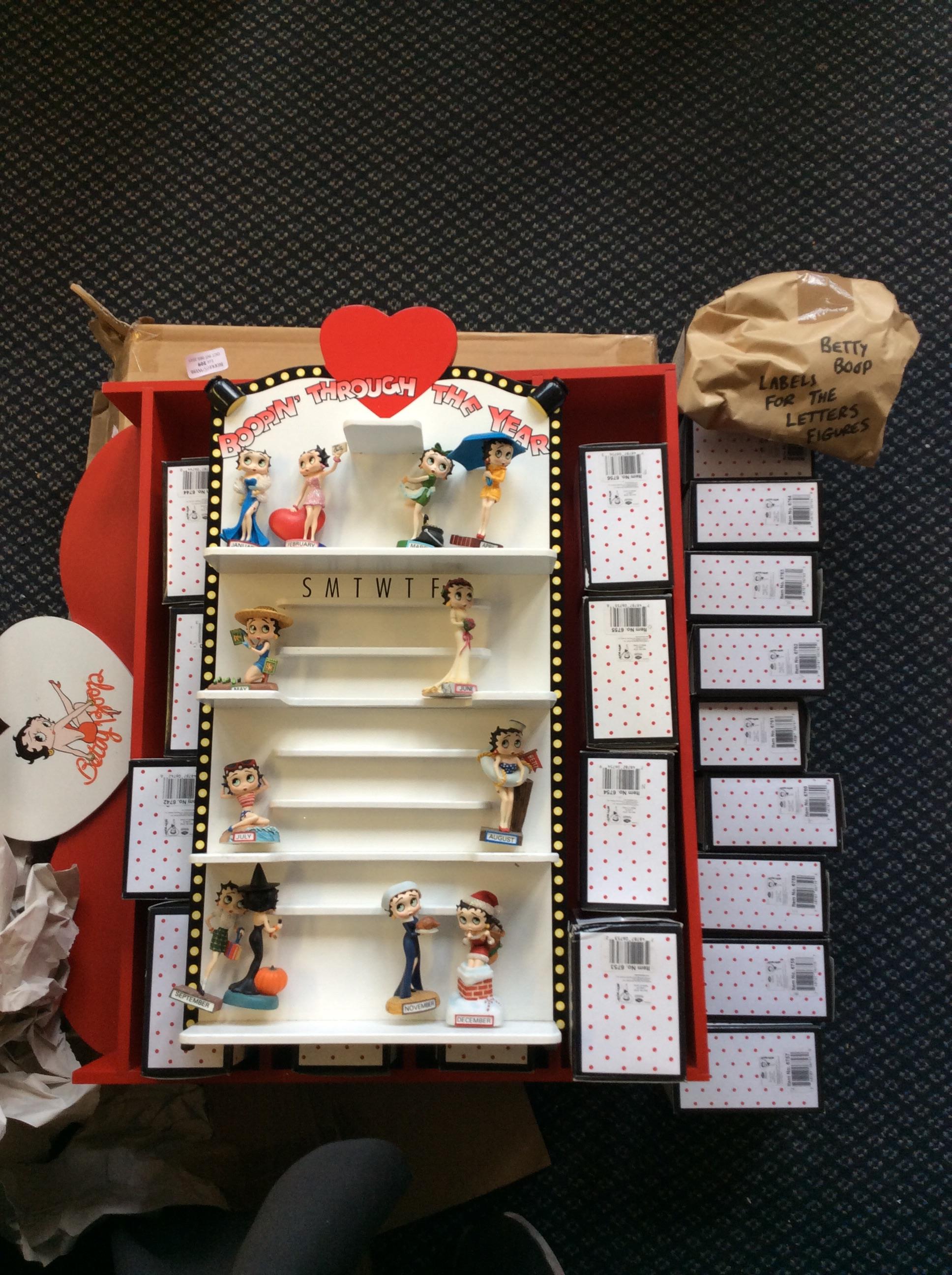 A Betty Boop alphabet set including 26 figures and display shelves, together with Betty Boop