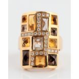 An 18ct yellow gold Rodney Rayner multi-gemstone ring, the rectangular head set with a geometric