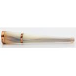 A hallmarked 9ct rose gold mounted mother of pearl cheroot holder, in fitted box.