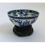 A Chinese blue and white bowl with dragon to centre, characters marks to base Kangxi dynasty,