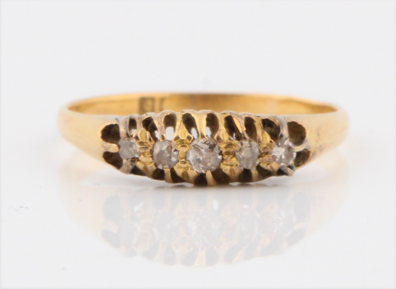 A diamond five stone ring, set with five graduated old cut diamonds, total diamond weight approx.